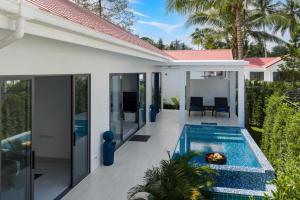 an external view of a house with a swimming pool at Buddha Bliss Luxury Villa in Ban Madua Wan
