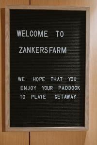 a sign that says welcome to zaminhers farm we hope that you enjoy your at Organic Farm Stay by Tiny Away in Numurkah +26 photos