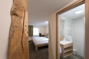 Postel nebo postele na pokoji v ubytování Hotel Gasthof Sonne