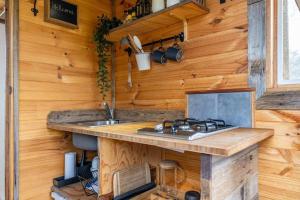 a kitchen in a tiny house with a sink at Deep Creek Sunset by Tiny Away in Romsey