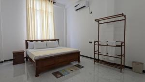 a bedroom with a bed in a room at Breeze house in Tangalle