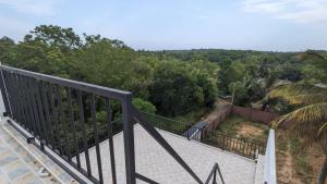 a view from the balcony of a house at Breeze house in Tangalle
