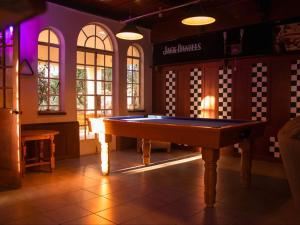 a pool table in the middle of a room at The White Castle in Chartwell