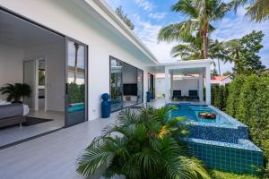a swimming pool in the backyard of a house at Buddha Bliss Luxury Villa in Ban Madua Wan