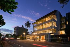 a building on the side of a street at night at Stay Ceylon - Weligama in Weligama