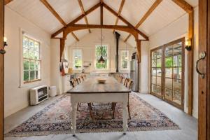 a kitchen with a table and chairs in a room at Amara Creek Retreat in Margaret River Town