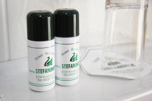 two bottles of cleaning products sitting on a counter at Hotel-Restaurant Stefanihof in Fuschl am See