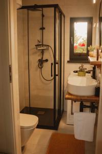 a bathroom with a shower and a sink at Cudomki nad jeziorem Krzywym in Piecki +62 photos