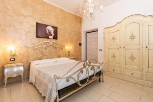 a bedroom with a white bed in a room at Martina B&B in Agropoli