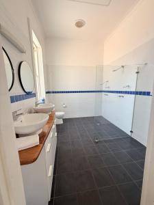 a bathroom with two sinks and a glass shower at Imperial Homestead in York