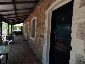 a black door on the side of a brick building at Imperial Homestead in York