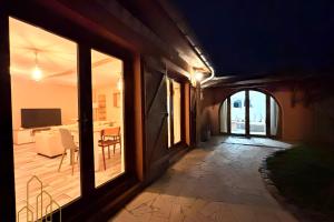 a hallway of a house with a view of a patio at L'instant Douceur in Riorges