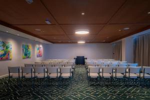 a room with chairs and a podium in it at Hotel Indigo Bridgetown Barbados by IHG in Bridgetown +271 photos