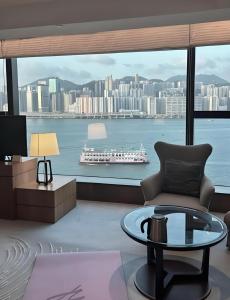 a living room with a view of a city at 枫枫枫 in Hong Kong