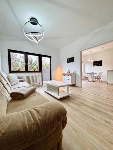 a living room with a couch and a table at Appartment in Freizeitpark in Wiesloch