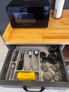 a kitchen counter with a sink and a microwave at The Rooms Lara in Antalya