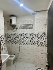 a bathroom with a toilet and a sink at Cabana suites in Rishīkesh +30 photos