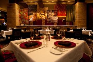 a table in a restaurant with white table cloth and wine glasses at Thunder Valley Casino Resort in Lincoln