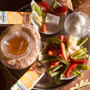 a plate of food with vegetables on a table at Blue rose in Abu Simbel