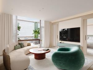 a living room with a couch and a table at Hotel Miramar Barcelona GL - LVX Preferred Hotels & Resorts - Newly Renovated in Barcelona