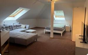 a living room with a couch and a bed at Monteur-, Ferienzimmer in Ibbenbüren
