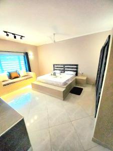 a bathroom with a large tub in a room at Villa SunShine exclusive in Watamu +41 photos