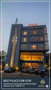 a hotel with cars parked in front of it at Hotel 26 in Islamabad