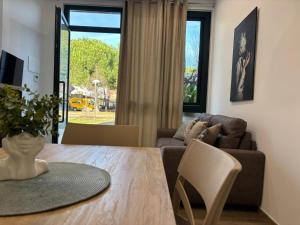 a living room with a table and a couch at SARA - interno 1 - Premium Villas in Giulianova