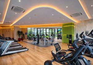 a gym with a bunch of exercise bikes in a room at Work & Travel in Kathu