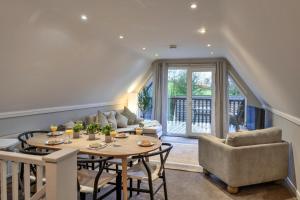 a living room with a table and chairs at Finest Retreats - Toblerone Lodge in Callington