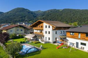 an aerial view of a resort with a playground at Ferienhaus Helmuth Oberreiter in Flachau