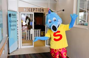 a person dressed in a wolf costume standing in front of a door at Crescent 6 in Christchurch +21 photos