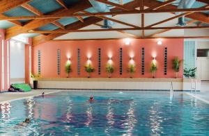 a swimming pool with people in the water at Crescent 6 in Christchurch