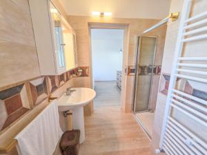 a bathroom with a sink and a shower at GHouse in Gallipoli