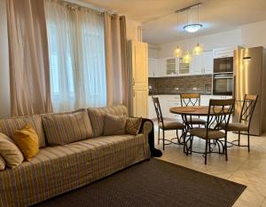 a living room with a couch and a table at GEORGIANA in Buzău