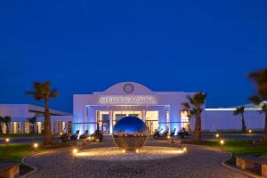a building with a large bowl in front of it at Meliá Laguna Beach - Adults Only in Santa Maria