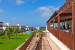 a view of the beach from the balcony of a resort at Meliá Laguna Beach - Adults Only in Santa Maria