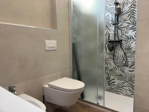 a bathroom with a toilet and a shower at SARA - interno 2 - Premium Villas in Giulianova +8 photos