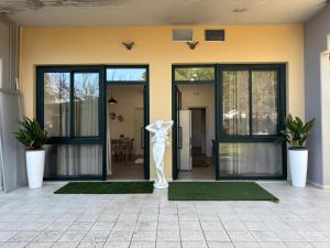 a front door of a house with a statue at SARA - interno 2 - Premium Villas in Giulianova