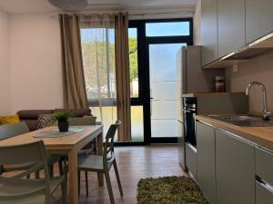 a kitchen and living room with a table and a dining room at SARA - interno 2 - Premium Villas in Giulianova