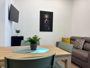 a dining room with a table and a couch at SARA - interno 2 - Premium Villas in Giulianova