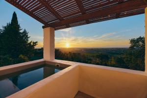 a view of the sunset from a hot tub at Casa Nature Paestum in Capaccio-Paestum
