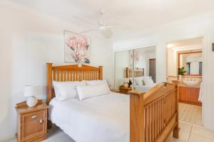 a bedroom with a large bed and a bathroom at The Breakers Yamba in Yamba +99 photos