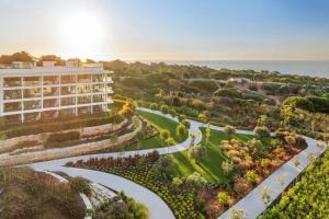 an aerial view of a hotel with a garden at W Algarve in Albufeira