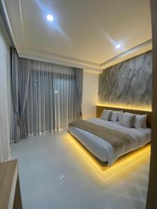 a bedroom with a large bed and a large window at The Casa Del Forest Ao-Nang in Ban Nong Thale +23 photos