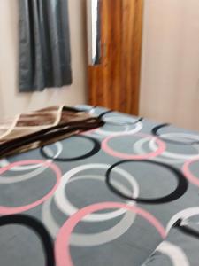 a table with black and pink circles on it at Prolife Tathwade in Méribel Village