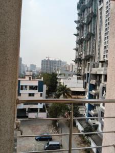 a view from a balcony of a city with tall buildings at Prolife Tathwade in Méribel Village