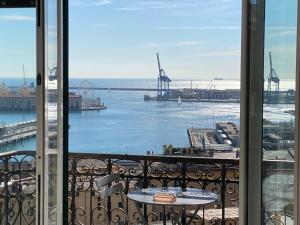 a view of the ocean from a balcony at B&B Luci del porto in Genoa