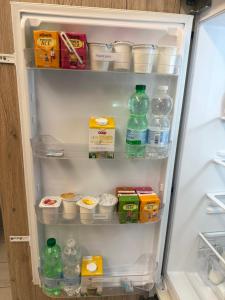 an open refrigerator filled with lots of food and drinks at Rosy Bed&Breakfast in Terni