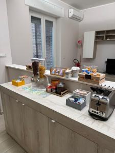 a counter in a kitchen with food on it at Rosy Bed&Breakfast in Terni